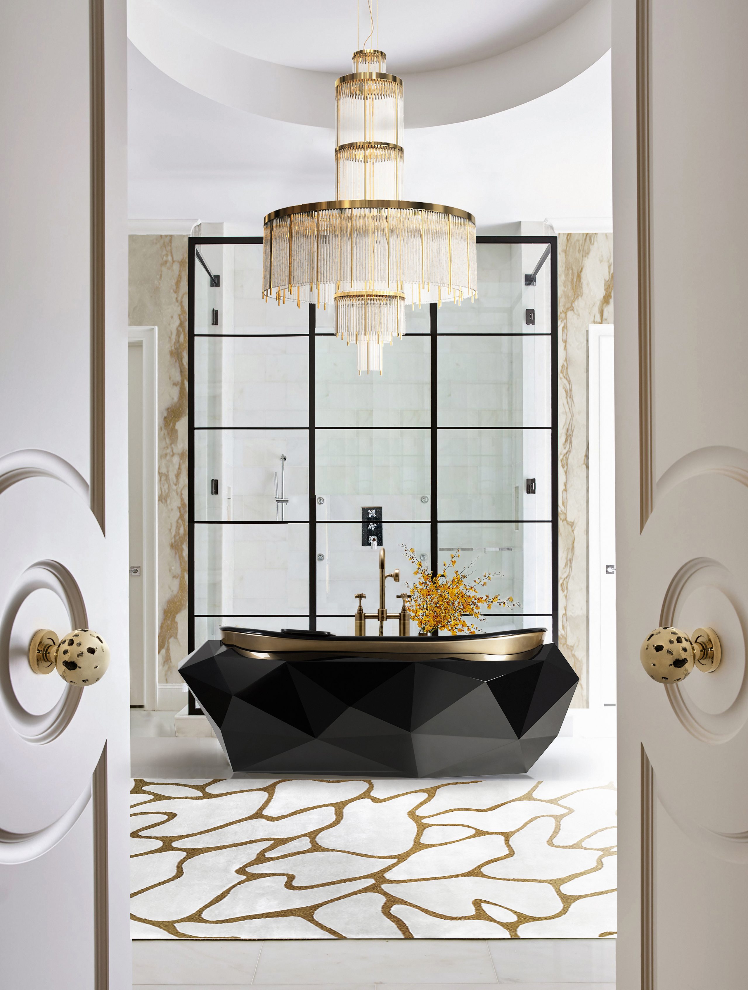 gold detailed bathroom with a black and gold freestanding bathtub in the middle and a white and gold rug